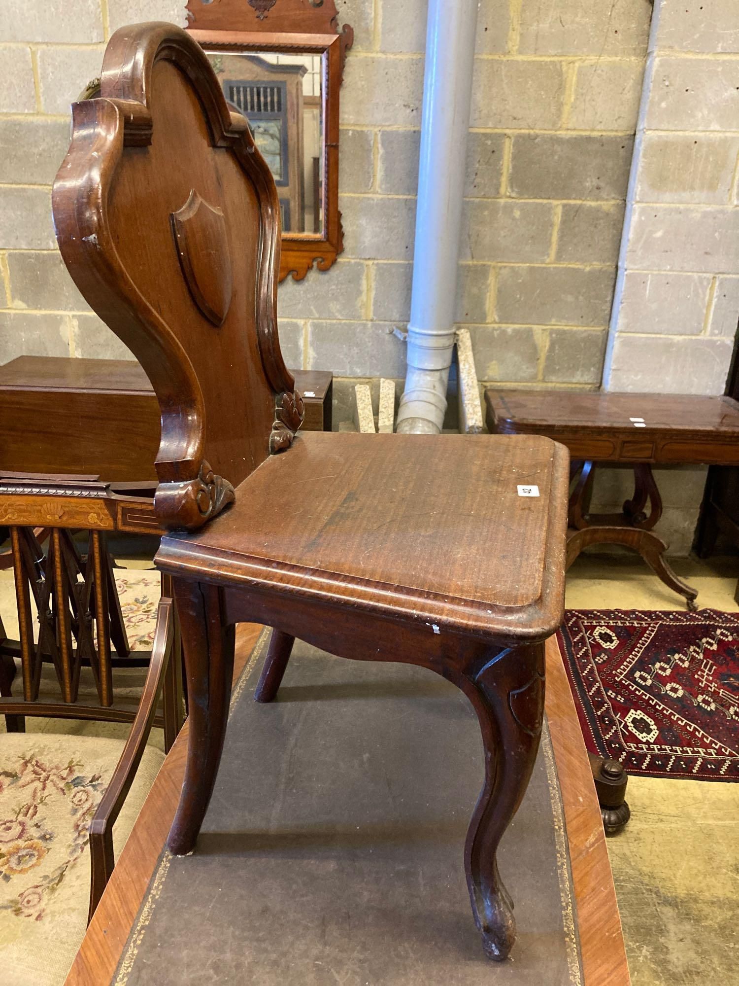 A Louis XVI style kingwood writing table, with central drawer, width 114cm and a Victorian mahogany hall chair